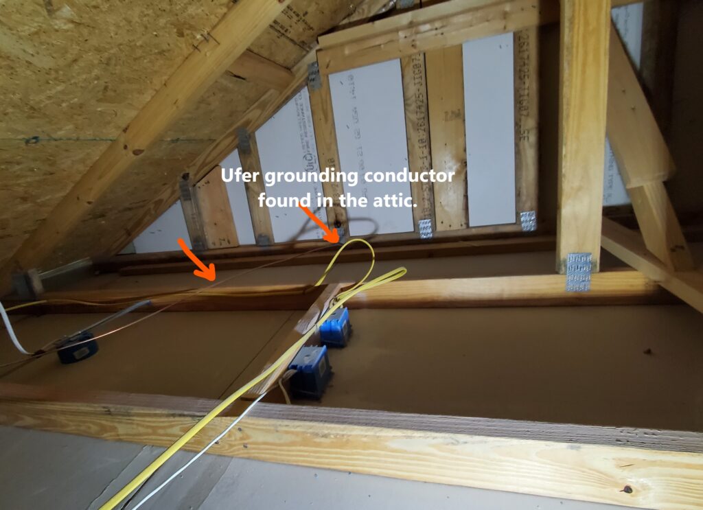 The ufer ground which is often the 2nd grounding source was not visible. The grounding conductor for the ufer ground was found in the attic going down into the exterior wall in the garage.  Noted by Powerworks Inspections during a New Construction home inspection.