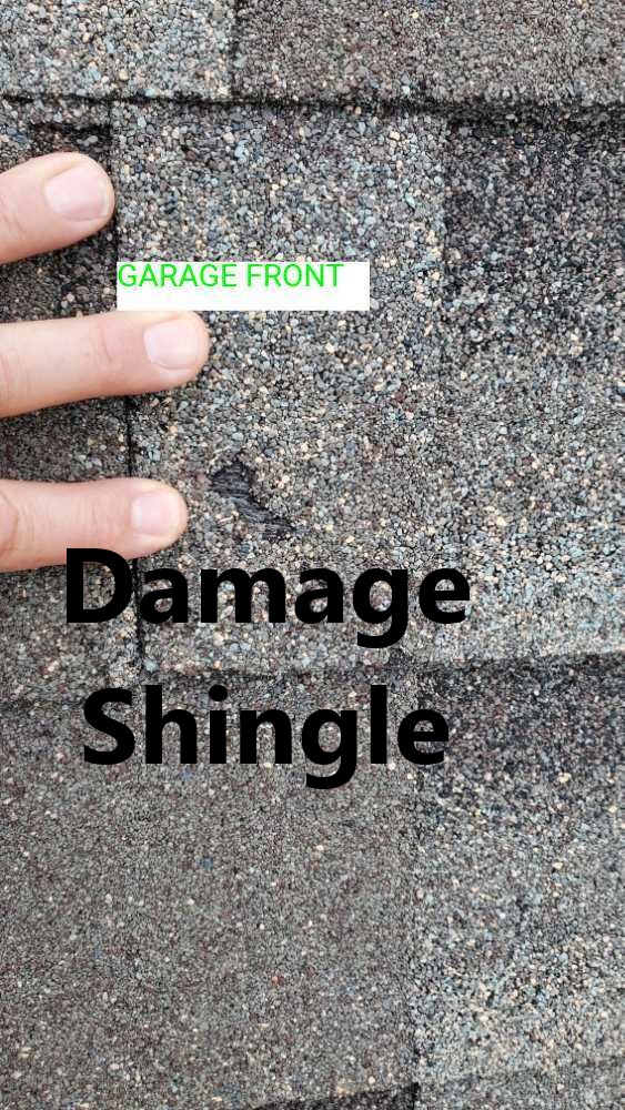 Damage shingles noted during a 11 Month Warranty during an inspection by Powerworks Inspections