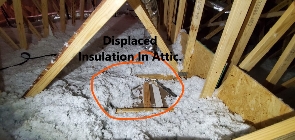 Missing or displaced insulation. This shold be replaced to restore the R- Value of the insulation level. Noted by Powerworks Inspections during a 11-Month Warranty Inspection home inspection in Peachtree City Ga.