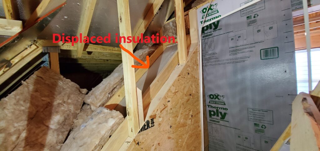 Missing or displaced insulation. This shold be replaced to restore the R- Value of the insulation level. Noted by Powerworks Inspections during a 11-Month Warranty Inspection home inspection in Peachtree City Ga.