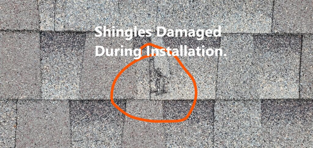 Shingles were damaged during installation and noted at the time of the 11-Month Warranty home inspection in Peachtree City Ga.. Shingle damage during installation is not an uncommon occurance. Noted by Powerworks Inspections during a 11-Month Warranty Inspection.