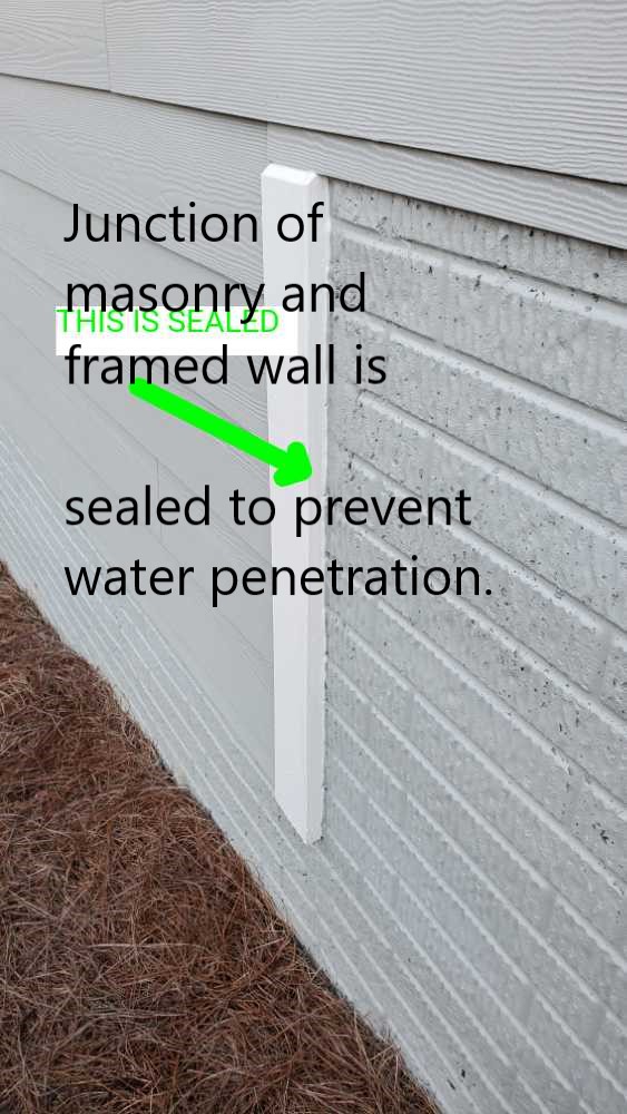 Junctions of masonry walls and windows or framed walls should be sealed to prevent water penetration. Noted by Powerworks Inspections during a New Construction home inspection in Newnan Ga.