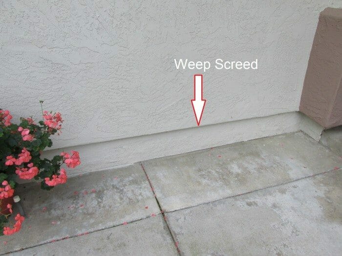 Here a weep screed is installed to allow proper drainage and create a termite break. This is in keeping with IRC 2012, 703.6.2.1 and 2018. R 703.7.2.1 FLASHING AT FOUNDATION: